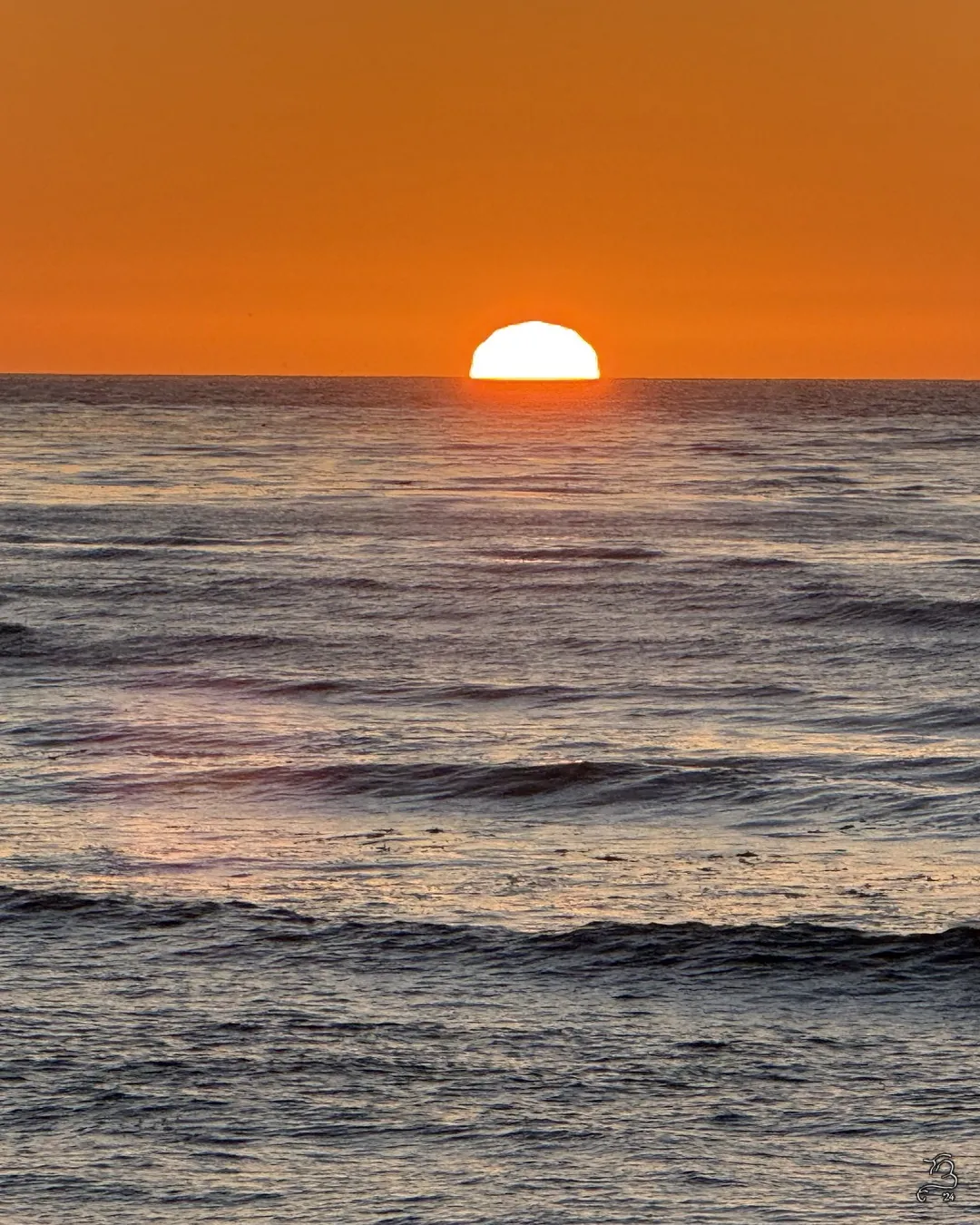 Half sun setting over Bluff Cove, Palos Verdes